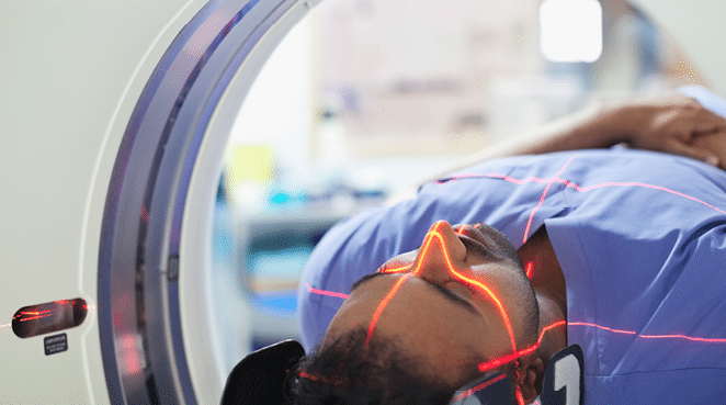 Mid adult male patient going through CAT scan