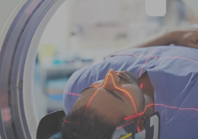 Mid adult male patient going through CAT scan