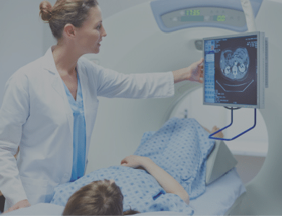 Female doctor showing CT scan to patient in examination room at hospital
