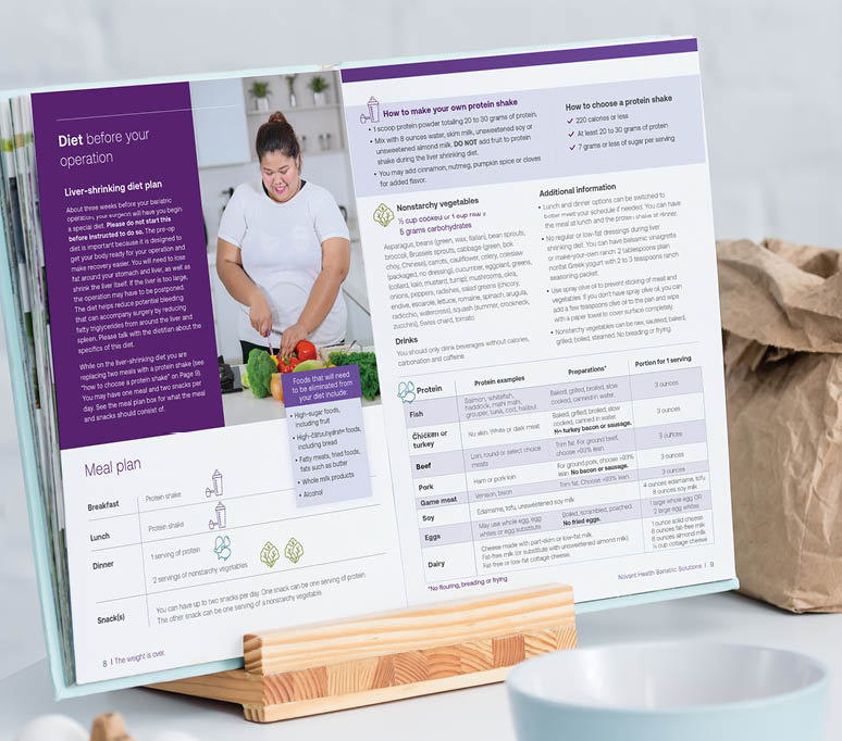blank opened cookbook on table with cooking utensils and bakery ingredients