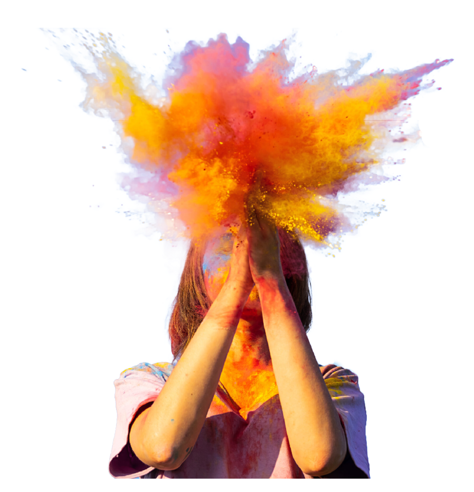 Woman covered in holi powder against blue sky. Holi colours festival.