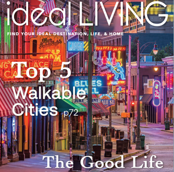 The cover of the July 2024 issue of Ideal Living features a vibrant cityscape at night with neon lights and a bustling atmosphere. The magazine is focused on finding your ideal destination, home, and lifestyle. AI generated content